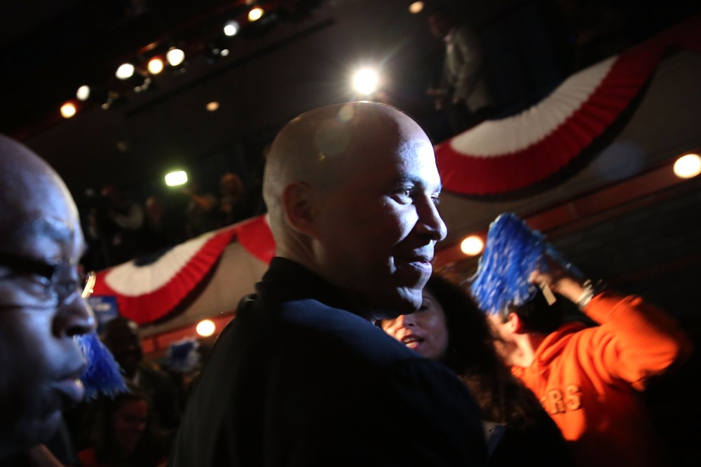 Newly elected U.S. Senator Cory Booker walks on stage to speak after winning a special election on October 16, 2013 in Newark, New Jersey.
