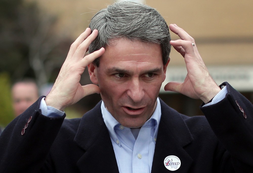 Ken Cuccinelli talks with supporters while greeting voters at Hanover Precinct 304 at Atlee High School on November 5, 2013 in Mechanicsville, Virginia.