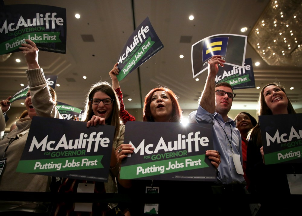 Supporters participate in the election night event of Democratic Virginia gubernatorial candidate Terry McAuliffe, November 5, 2013 in Tysons Corner, Virginia.