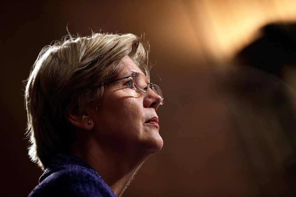 Sen. Elizabeth Warren (D-MA) listens as Consumer Financial Protection Bureau Director Richard Cordray testifies before the Senate Banking, Housing and Urban Affairs Committee on Nov. 12, 2013 in Washington, DC.