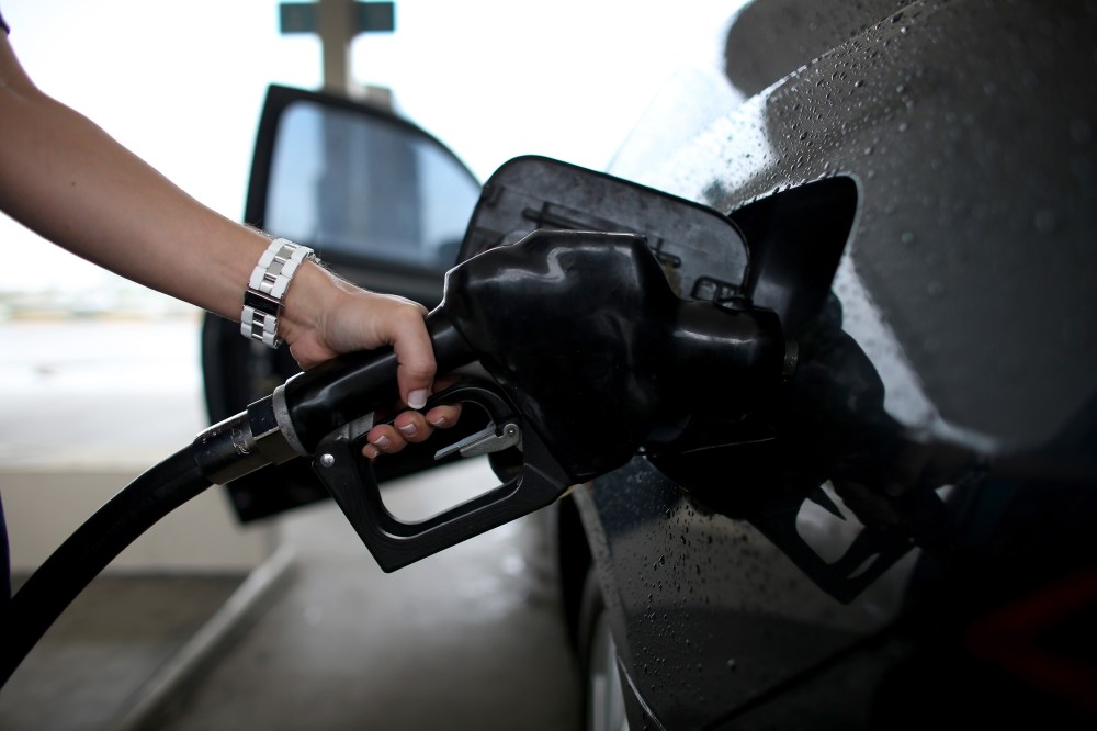 A woman pumps gas into her car on Nov, 15, 2013 in Pembroke Pines, Fla. (Joe Raedle/Getty)