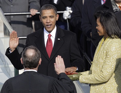 Barack Obama, joined by his wife Michelle, takes the oath of office from Chief Justice John Roberts to become the 44th president of the United States at the U.S. Capitol in Washington, D.C., in this Jan. 20, 2009 file photo. (Photo by Jae C. Hong/AP...