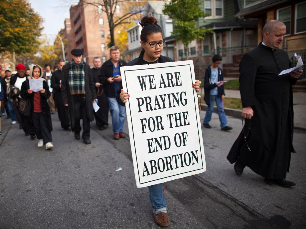File Photo: A woman holds a sign during an anti-abortion protest march to the Choices Women's Medical Center in Queens, New York October 20, 2012. The protest was organized by local church, Presentation of the Blessed Virgin Mary and targeted the...
