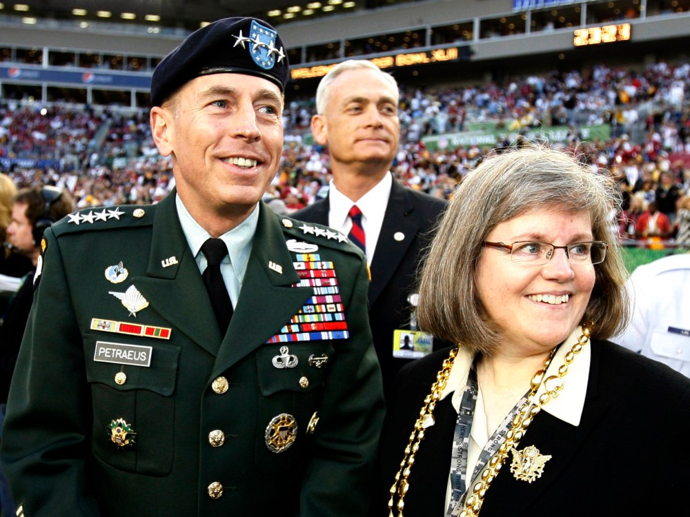 File Photo. Former CIA Director David Petraeus and his wife Holly. Petraeus fall from grace following an affair with his biographer, Paula Broadwell, has shaken the Washington, D.C. establishment. (Photo by Jeff Haynes/Reuters/Files)