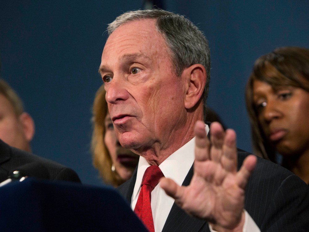 New York City Mayor Michael Bloomberg (C), along with survivors and family members of gun violence victims, addresses the media as part of the Mayors Against Illegal Guns group, to announce the release of 34 "I Demand a Plan" videos in New York...