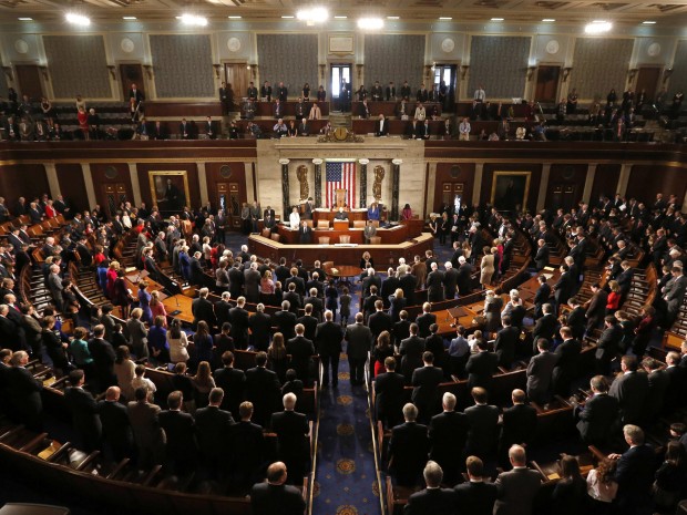 Members of the 113th Congress bow their heads in prayer as they convene in the Capitol in Washington January 3, 2013. In the wake of bruising fights in their own ranks over the "fiscal cliff" and aid for victims of superstorm Sandy - Republicans in the...