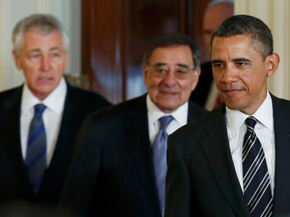 U.S. President Barack Obama (R) arrives in the East Room of the White House with his new nominee for Secretary of Defense former Republican U.S. Senator Chuck Hagel (L) and the current Secretary of Defense Leon Panetta (C) at the White House in...