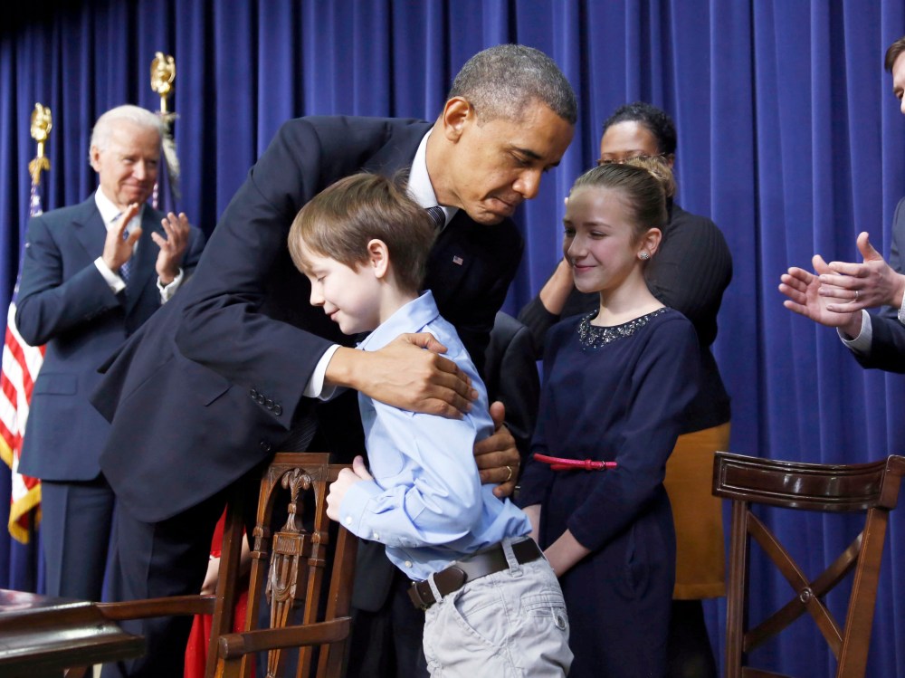 President  Obama hugs a young boy named Grant Fritz -- one of a group of children who wrote the president letters about guns and gun control -- after signing executive orders  on a series of proposals to counter gun violence during an event at the ...