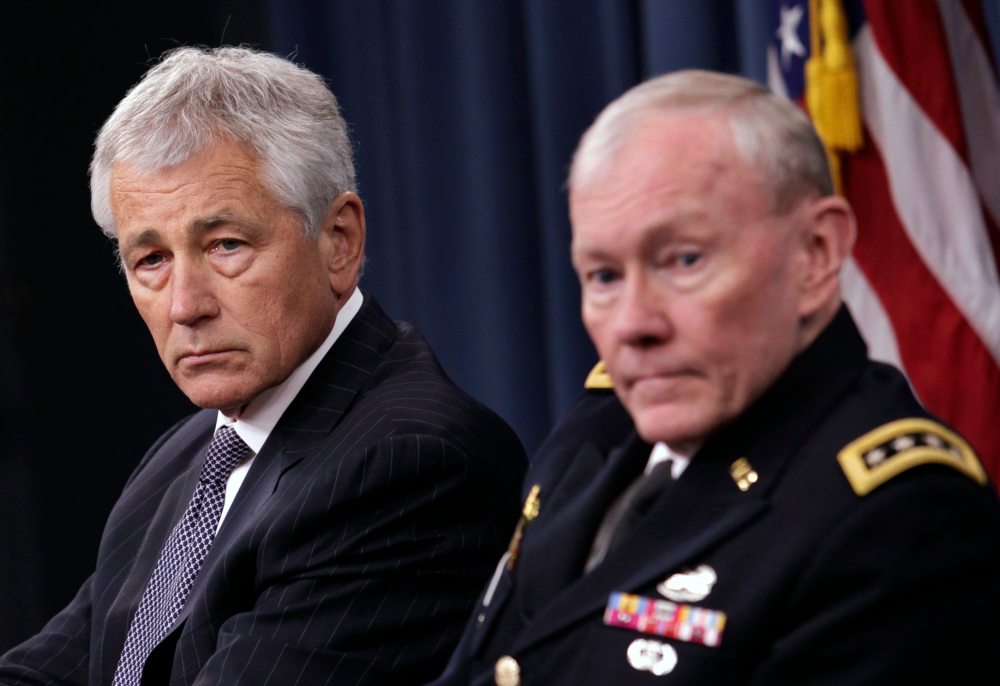 U.S. Secretary of Defense Chuck Hagel (L) and Joint Chiefs of Staff General Martin Dempsey hold a joint news conference at the Pentagon in Washington March 17, 2013.  (Photo by Yuri Gripas/Reuters)