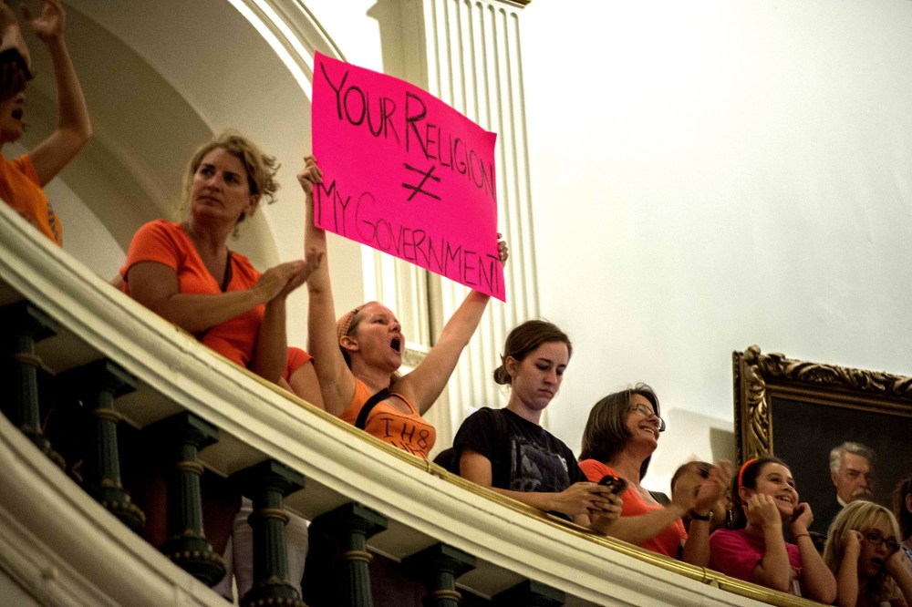 Demonstrators protest at State Capitol building in Austin, Texas, on July 12, 2013.