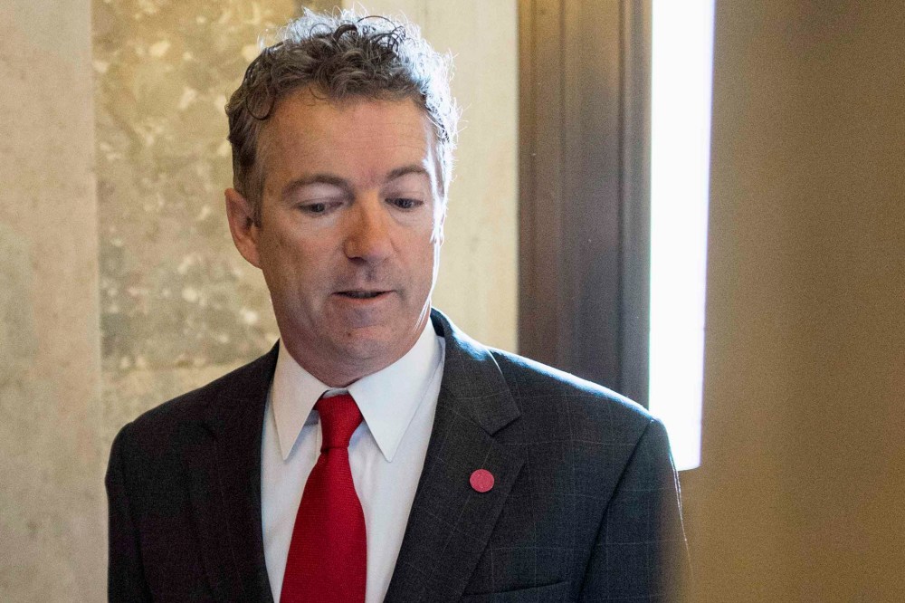 Senator Rand Paul (R-KY) arrives for the Republican weekly policy luncheon on Capitol Hill in Washington January 28, 2014.