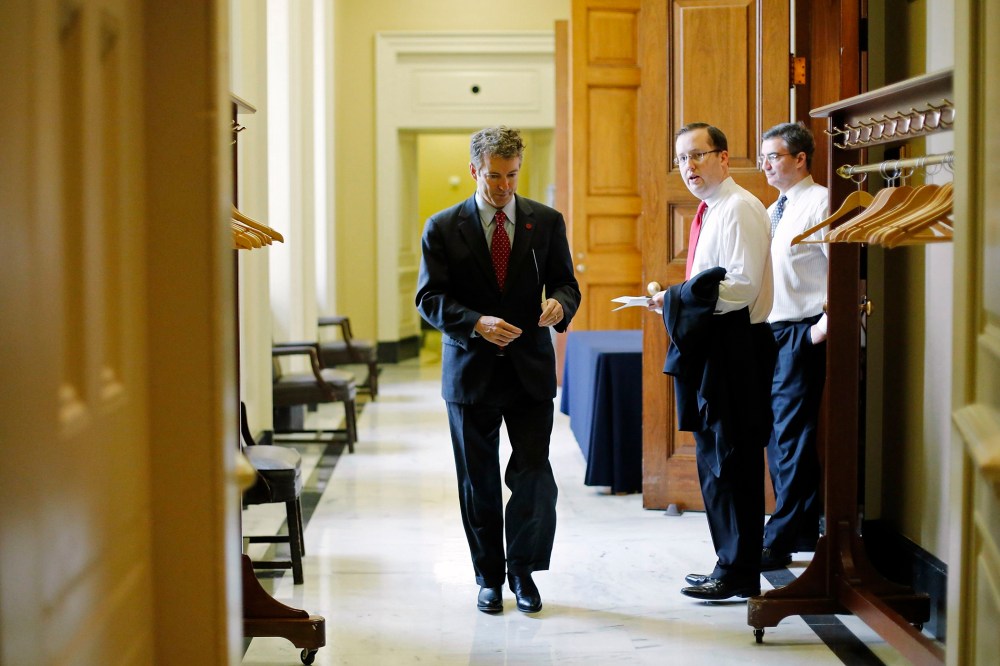 U.S. Senator Rand Paul (R-KY) returns to the Senate floor for a vote on whether to raise the debt ceiling, at the U.S. Capitol in Washington February 12, 2014.