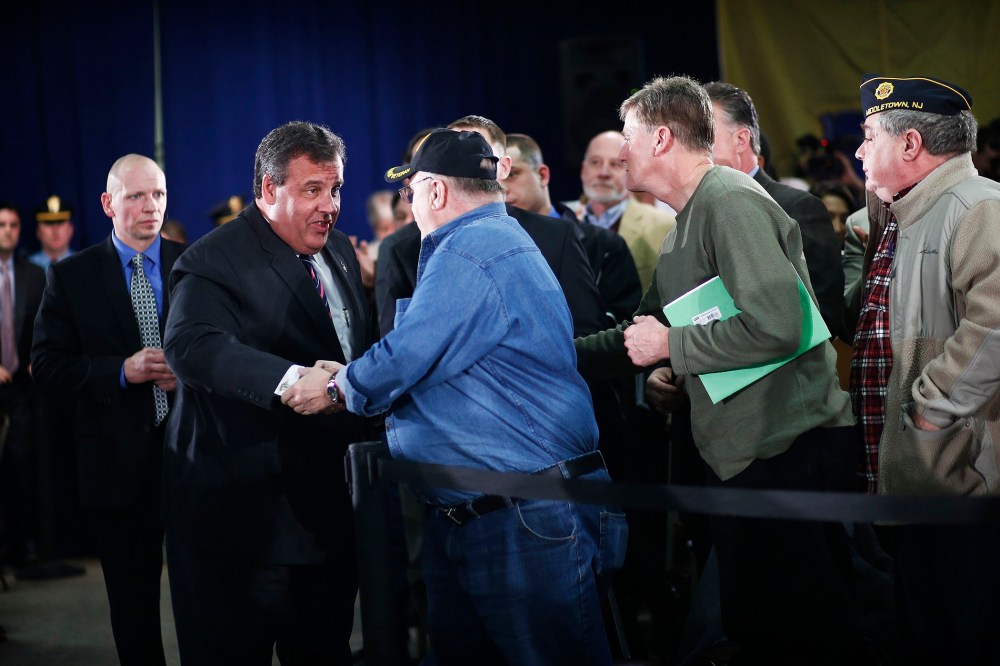 New Jersey Governor Chris Christie shakes hands with guests as he attends the 110th Town Hall Meeting in Middletown Township, on Feb. 20, 2014.