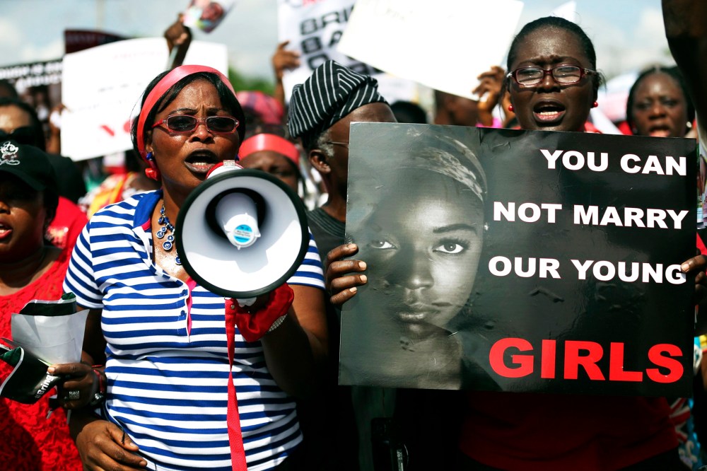 Women holding signs take part in a protest demanding the release of abducted secondary schoolgirls from the remote village of Chibok, in Lagos May 5, 2014.