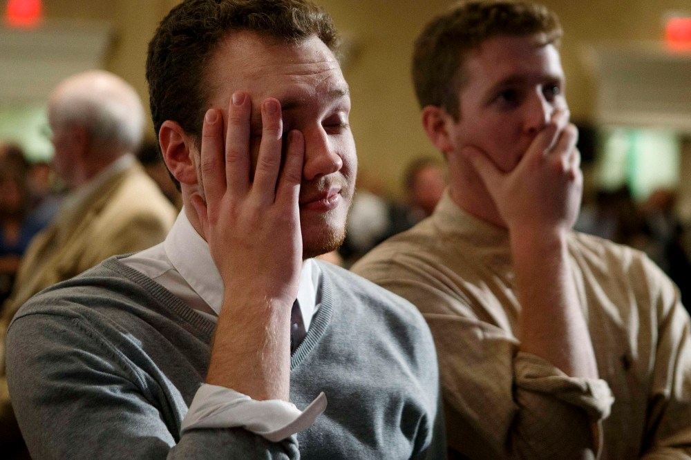 A supporter of Former Florida Governor and Democratic gubernatorial candidate Charlie Crist reacts to the midterm election being called in favor of Republican Florida Governor Rick Scott in St. Petersburg, Fla. on Nov. 4, 2014.