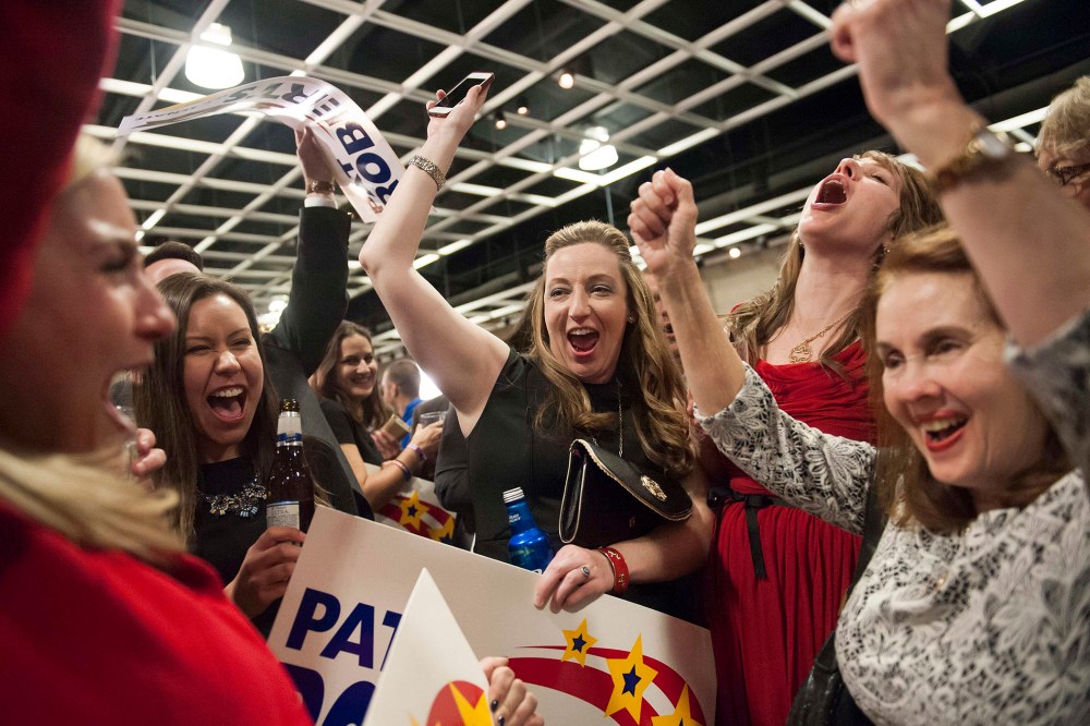 Supporters of Republican Pat Roberts react to announcements of the midterm elections results in Topeka, Kan. on Nov. 4, 2014. (Mark Kauzlarich/Reuters)