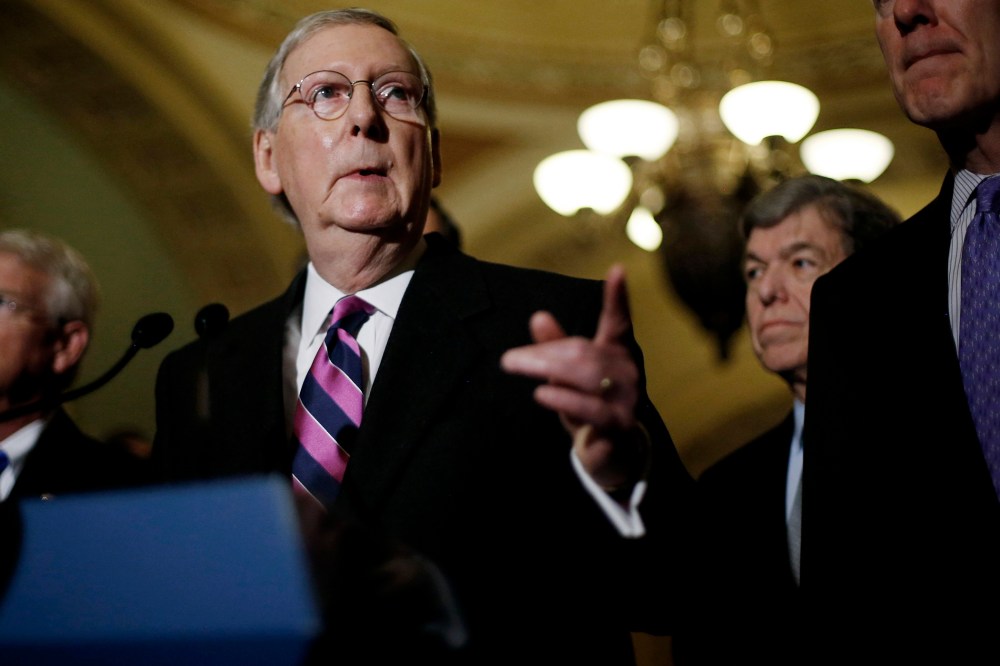 U.S. Senate Majority Leader Mitch McConnell (R-KY) calls on a reporter at a news conference after Democratic and Republican party policy luncheons at the U.S. Capitol in Washington on Jan. 7, 2015.