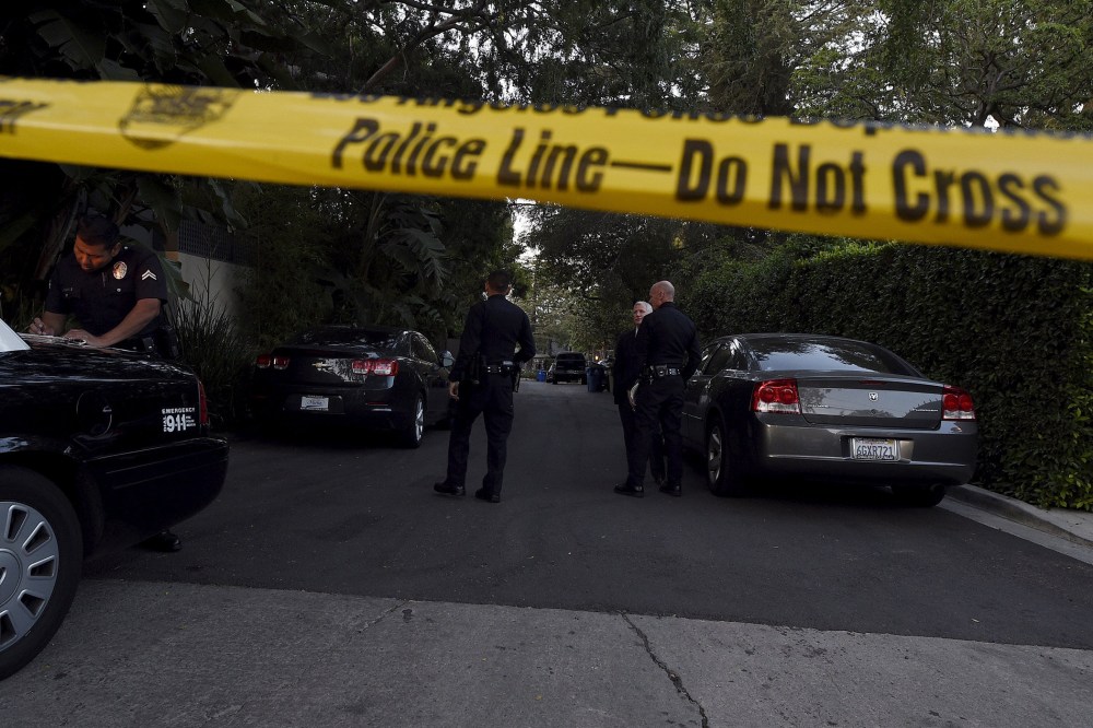 A yellow police tape and a police cruiser block off the street leading to the house of Andrew Getty, the grandson of Getty oil founder J. Paul Getty, in Los Angeles, Calif. on March 31, 2015. (Photo by Kevork Djansezian/Reuters)