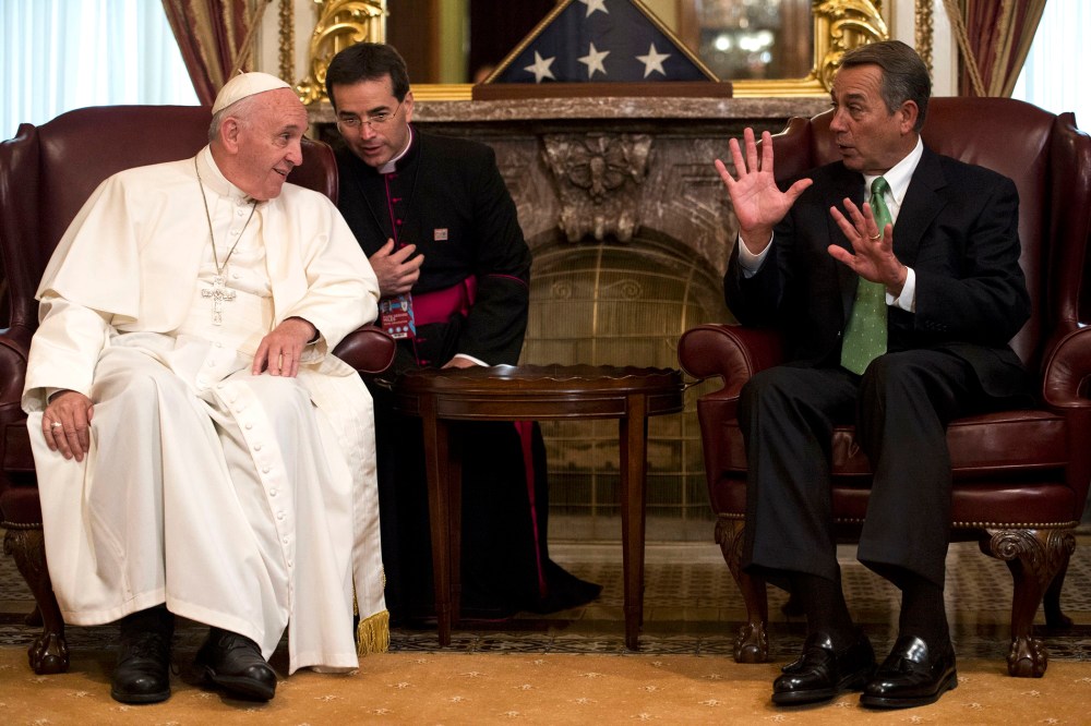 Speaker of the House John Boehner, R-Ohio (R) speaks with Pope Francis in the U.S. Capitol building as the Pope arrives to deliver his speech to a joint meeting of Congress on Sept. 24, 2015. (Photo by Bill Clark/Pool/Reuters)