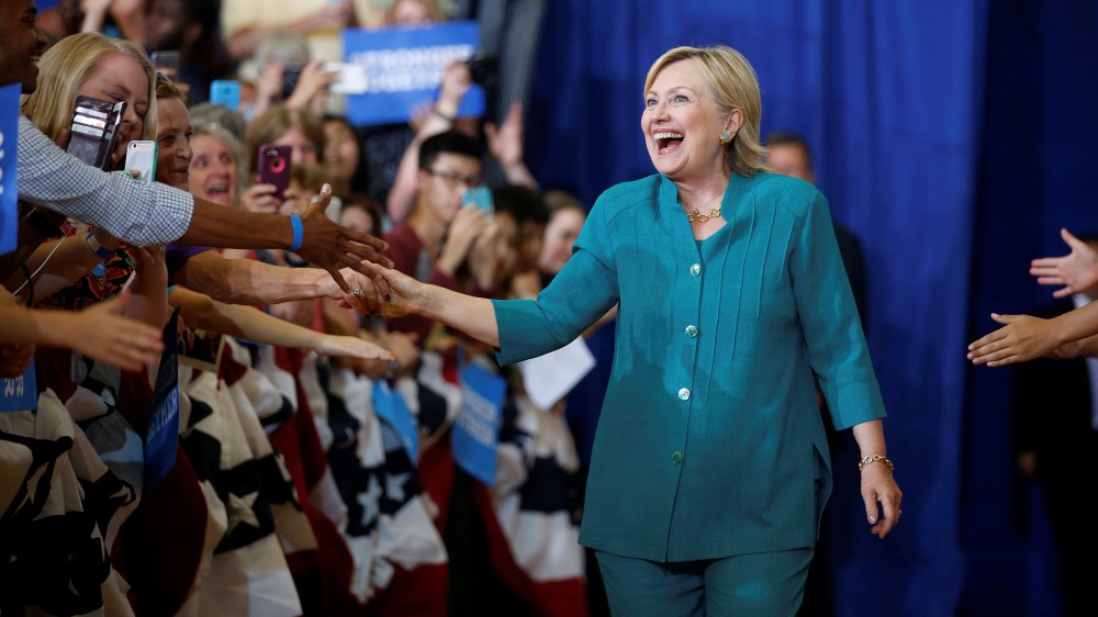 U.S. Democratic presidential nominee Hillary Clinton smiles as she greets supporters while arriving for a rally at Lincoln High School, Aug. 10, 2016, in Des Moines, Iowa. (Photo by Chris Keane/Reuters)