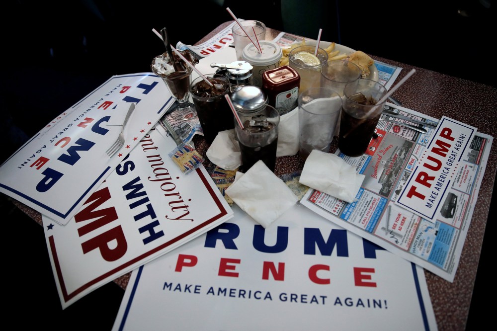 Signs for Republican presidential nominee Donald Trump are seen on a table during a Trump campaign stop at the Boulevard Diner in Dundalk, Md. on Sept. 12, 2016. (Photo by Mike Segar/Reuters)