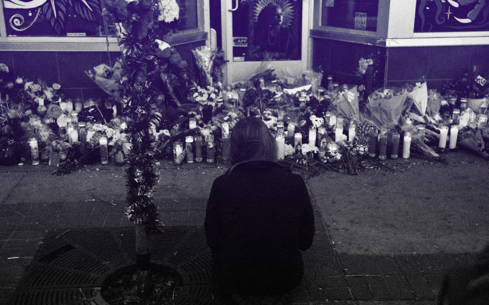 Image: A makeshift memorial outside of the tattoo shop where owner Alicia Cardenas was killed during a shooting spree in Denver on Dec. 29, 2021.