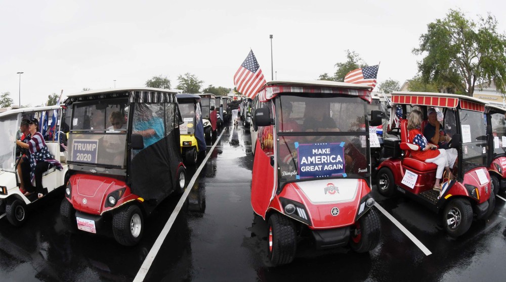 Backers of U.S. President Donald Trump line up for a golf