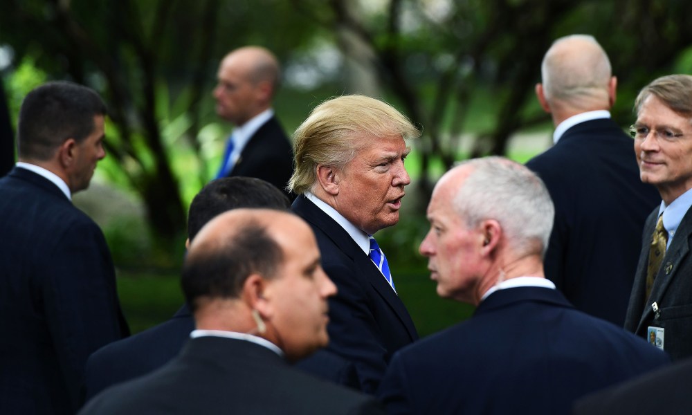 Image: Donald Trump surrounded by members of the Secret Service.