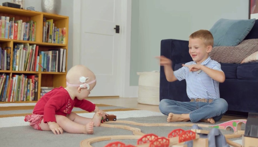 Leslie Danford's family, including her older children, have learned American sign language to communicate with her daughter, who was born with hearing loss.