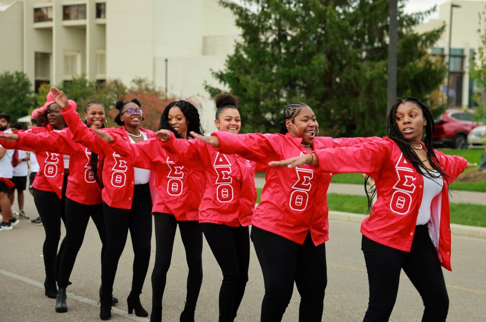Members of Delta Sigma Theta sorority dance during the Indiana University Homecoming Parade in Bloomington, Ind.