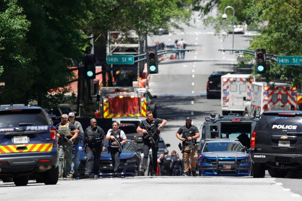 Law enforcement officers near the scene of an active shooter in Atlanta on May 3, 2023.
