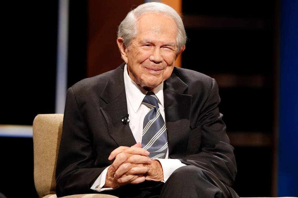 FILE - Rev. Pat Robertson poses a question to a Republican presidential candidate during a forum at Regent University in Virginia Beach, Va., Oct. 23, 2015. Robertson, a religious broadcaster who turned a tiny Virginia station into the global Christian Broadcasting Network, tried a run for president and helped make religion central to Republican Party politics in America through his Christian Coalition, has died. He was 93. Robertson's death Thursday, June 8, 2023 was announced by his broadcasting network. (AP Photo/Steve Helber, File)