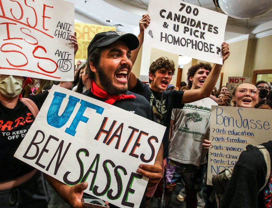 Aron AliMcClory, a second year UF student, works to lead a chant as students protest outside the President's Ballroom at Emerson Alumni Hall at the University of Florida as Sen. Ben Sasse, R- Neb., was scheduled to speak, on Oct. 10, 2022.
