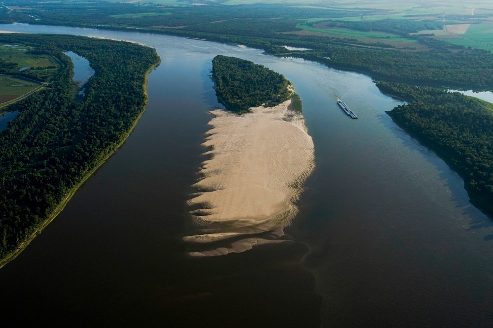 A tugboat navigates around a sandbar during a period of low water level in the Mississippi River in West Feliciana Parish, La., on July 21, 2023.