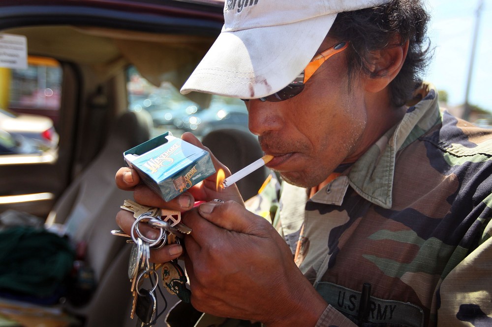Gedwyn Power smokes a menthol cigarette in Miami
