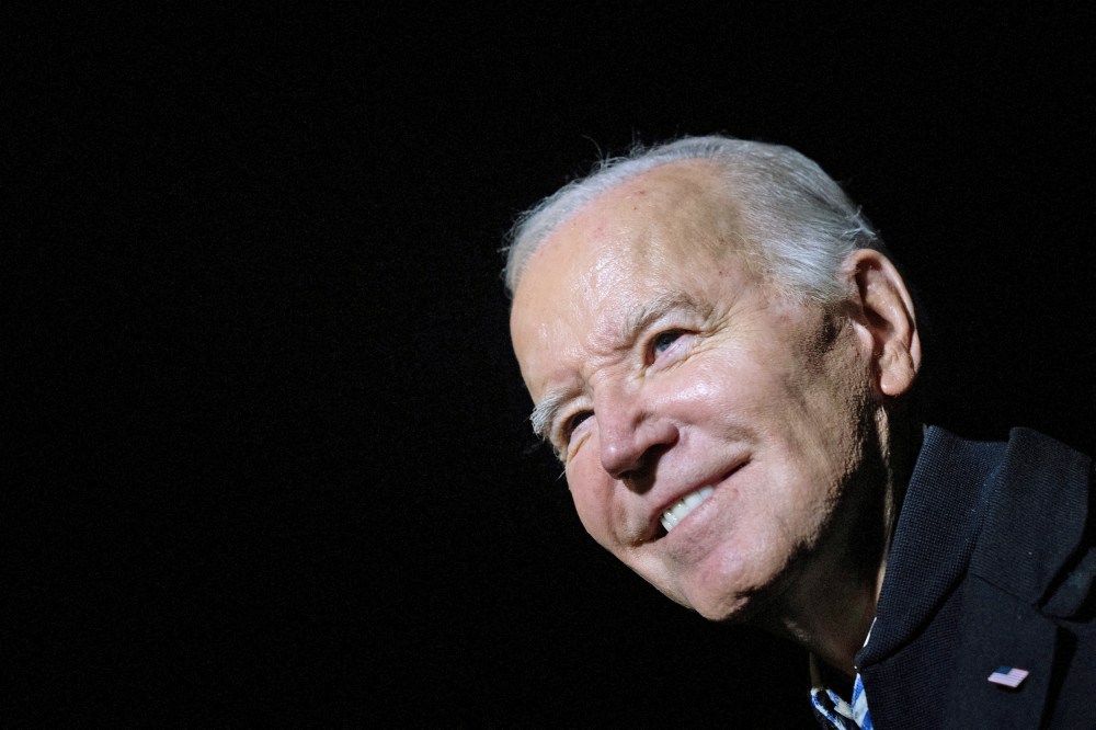 President Joe Biden stops to speak with members of the press as he walks from Marine One to the residence of the White House Dec. 20, 2023.