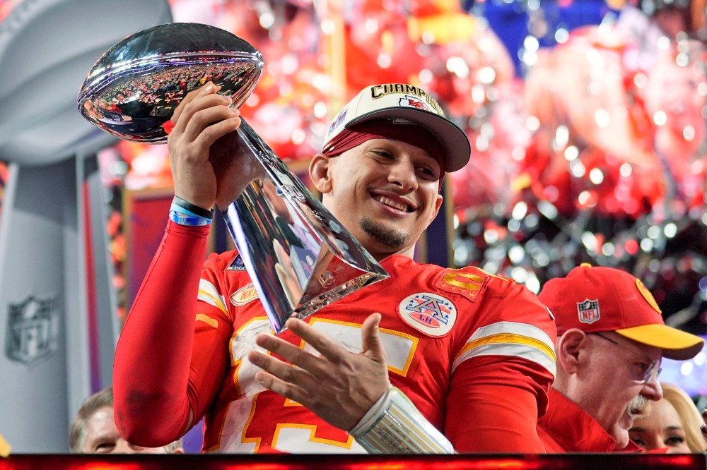 Kansas City Chiefs quarterback Patrick Mahomes celebrates with the trophy after the team's Super Bow win on Feb. 11, 2024, in Las Vegas.