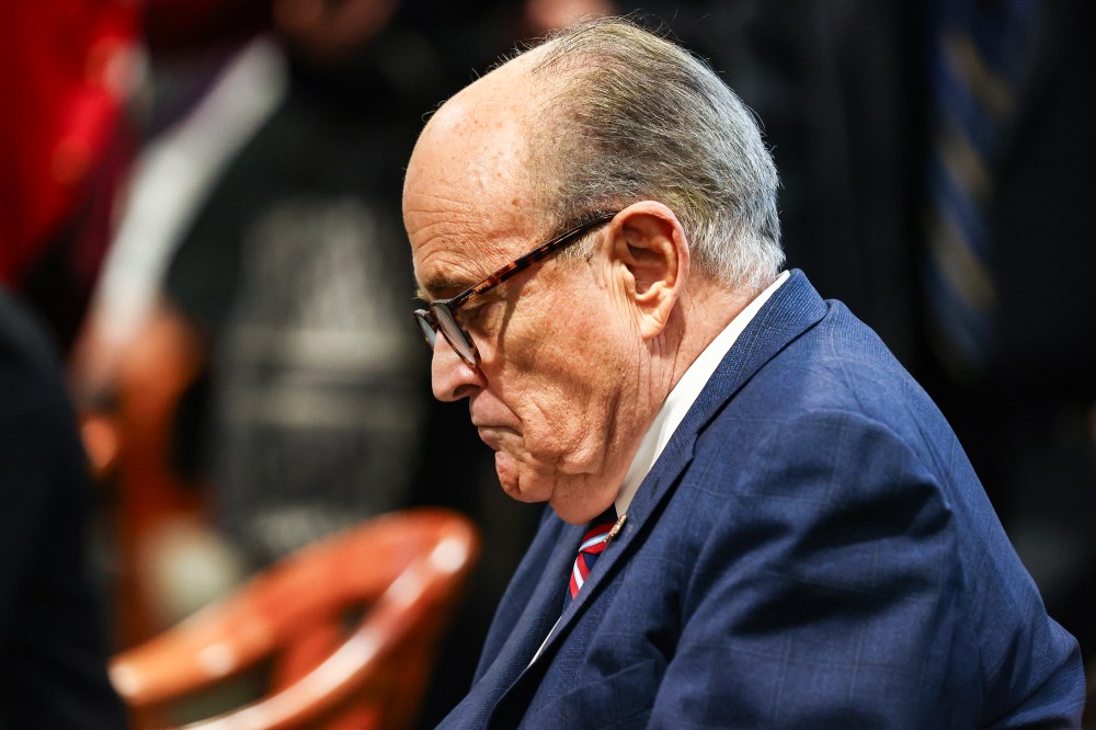 Rudy Giuliani side profile as he looks down