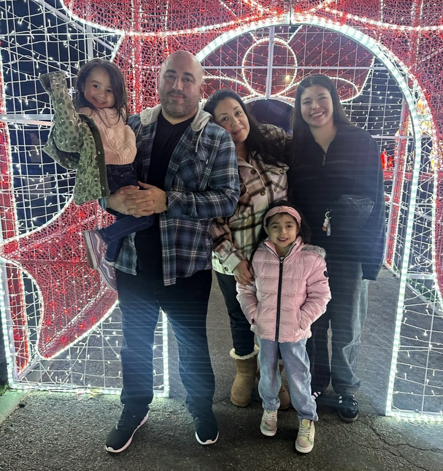 Lizbette Vazquez, center, with her husband and three children. 