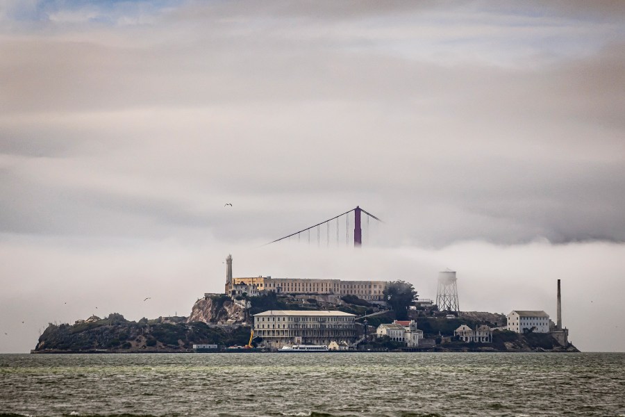 The clouds and fog shroud the Golden Gate Bridge and Alcatraz Island