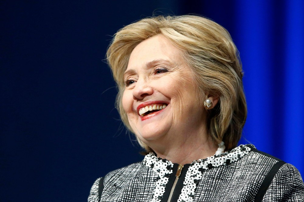 Former U.S. Secretary of State Hillary Clinton smiles at the World Bank in Washington, May 14, 2014.