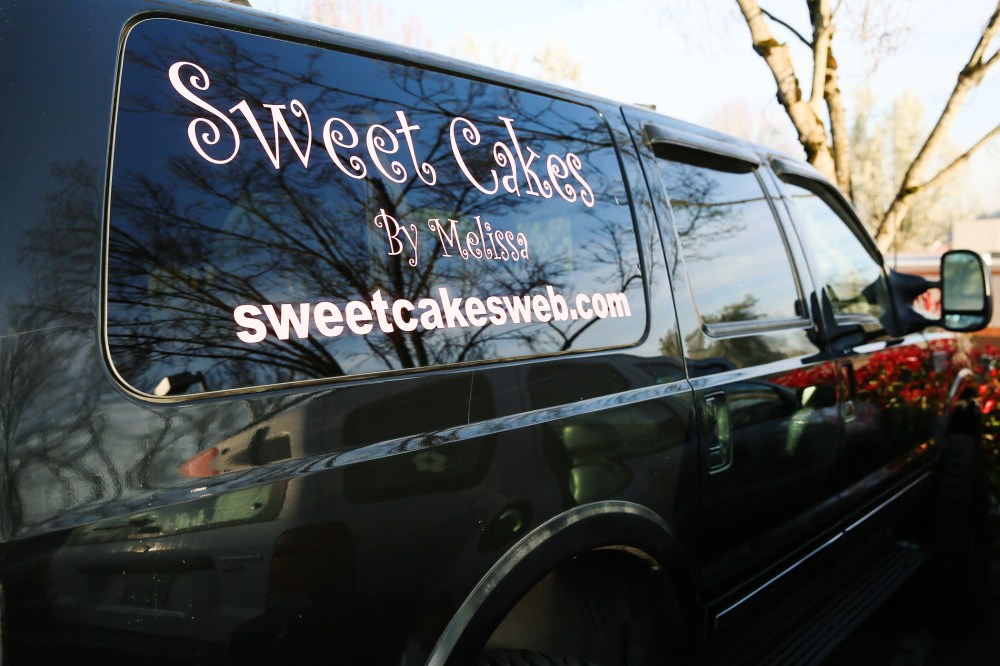 The Kleins' SUV, reflecting a sunny morning. They closed their shop and moved their business into their home after losing their discrimination claim. (Photo by John Rudoff/Demotix/Corbis)