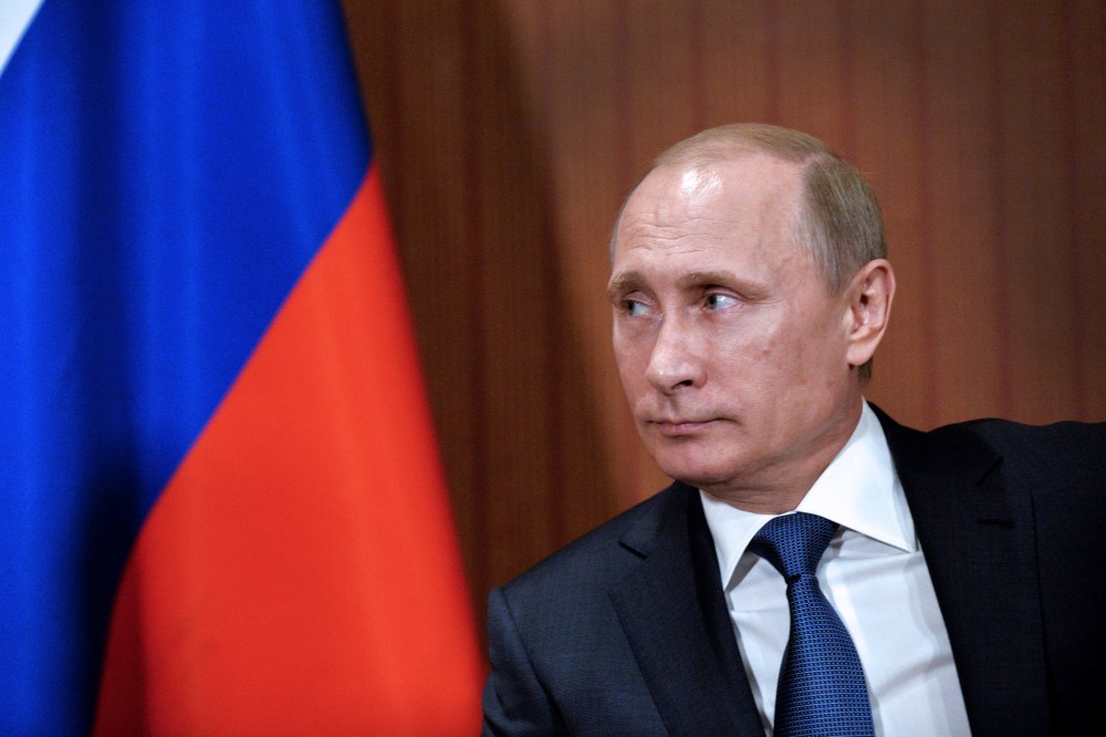 Russian President Vladimir Putin is seen during a meeting with and German chancellor (not seen) in Normandy Barriere hotel in Deauville on June 6, 2014.