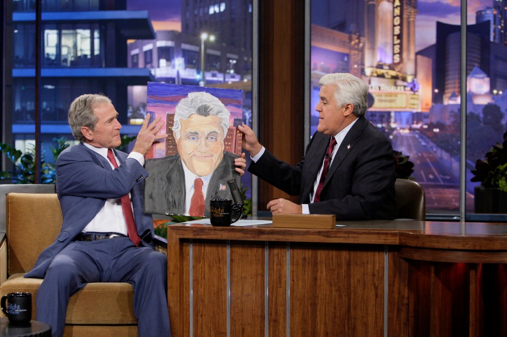 Former President George W. Bush presents Jay Leno with a portrait on Nov. 19, 2013