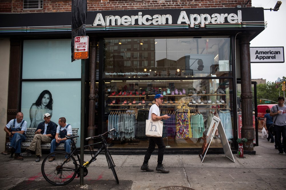 People walk past an American Apparel store on June 19, 2014 in New York City.