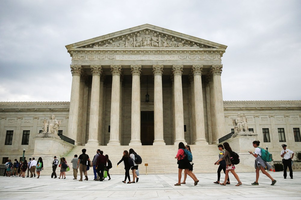 People arrive to attend the final session of the term at the U.S. Supreme Court on June 30, 2014 in Washington, DC.