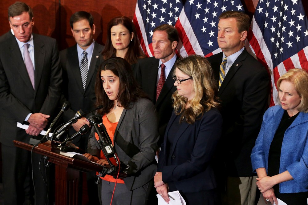 End Rape on Campus co-founders Andrea Pino and Annie Clark are joined by (L-R) Sen. Mark Warner (D-VA), Sen. Marco Rubio (R-VL), Sen. Kelly Ayotte (R-NH), Sen. Richard Blumenthal (D-CT), Sen. Dean Heller (R-NV) and Sen. Kirsten Gillibrand (D-NY) during a