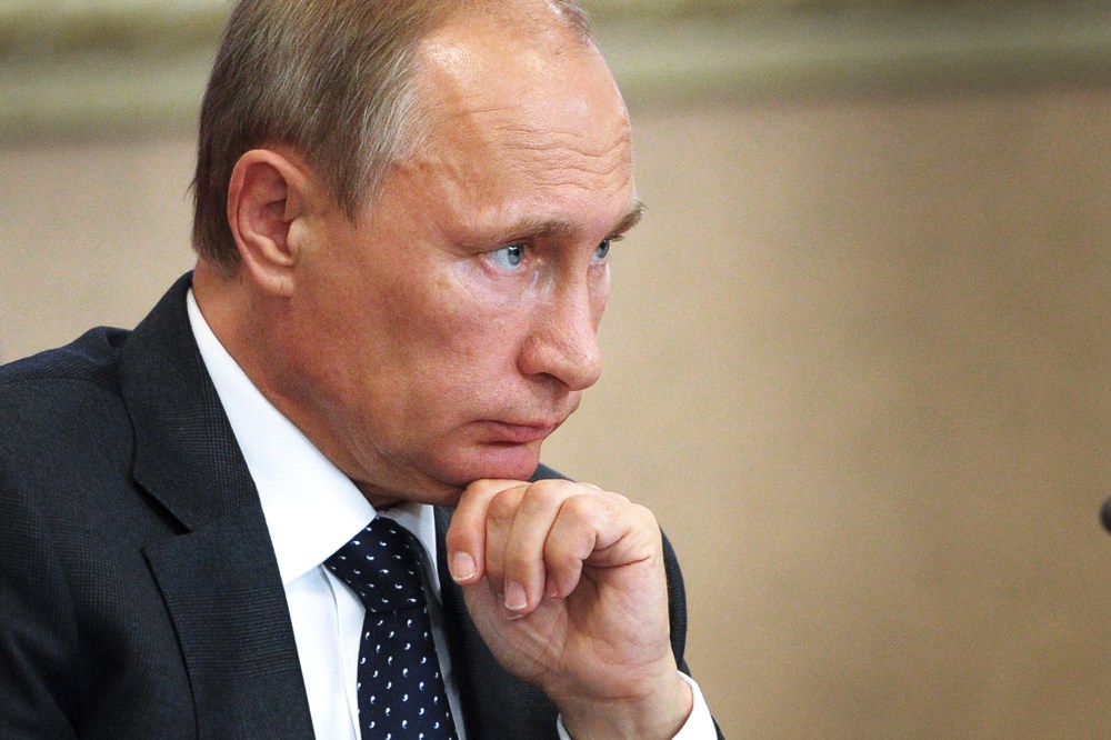 Russian President Vladimir Putin attends a local administration meeting as he visits Voronezh, Russia on Aug. 5, 2014. (Photo by Alexey Druzhinin/AFP/Getty)