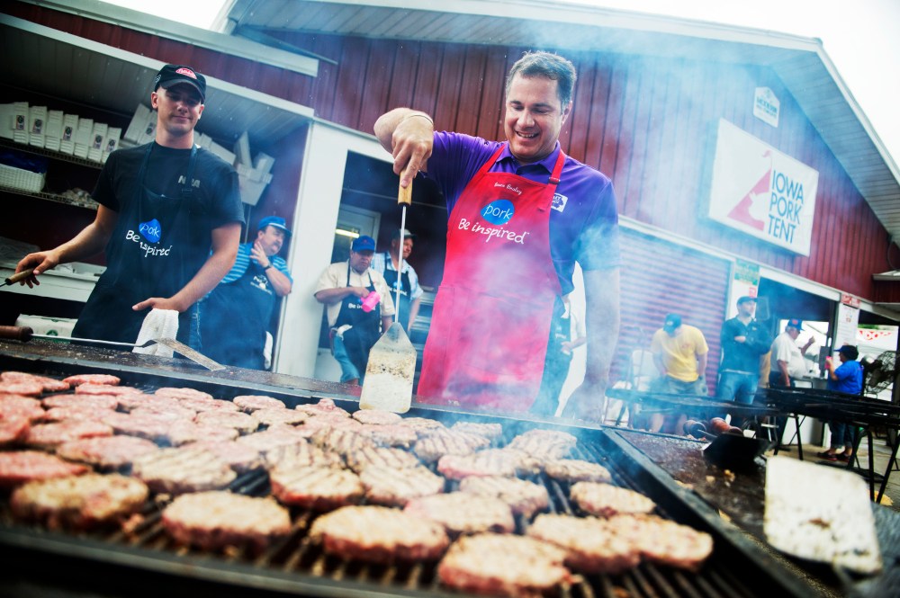 Senate candidate Rep. Bruce Braley, D-Iowa, helps out on the grill in the Pork Tent at the Iowa State Fair in Des Moines, August 7, 2014.