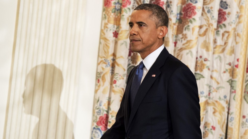 US President Barack Obama arrives to speak about the situation in Iraq in the State Dining Room at the White House in Washington, DC, August 7, 2014.